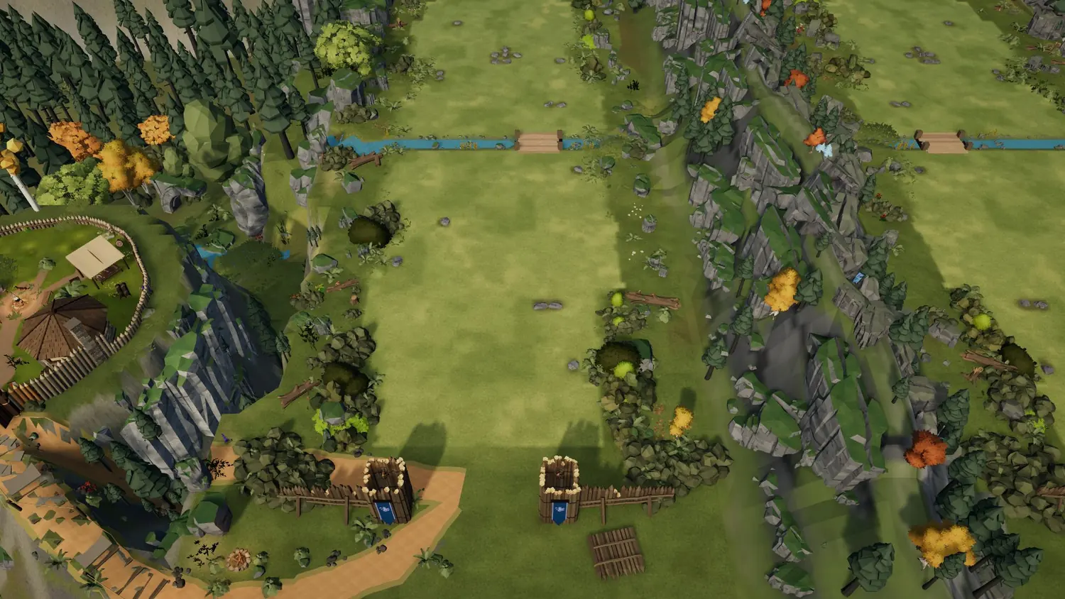 Game camera: the lane with the bridge at the top, meadow in the middle and the gate towers at the bottom
